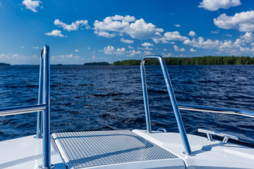 Fototapeta na wymiar Summer day on the like, view from boat, Finland