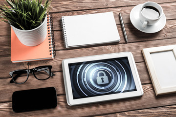 Web security and technology concept with tablet pc on wooden tab