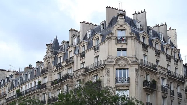 establishing shot of traditional residential apartment house in Paris, beautiful building