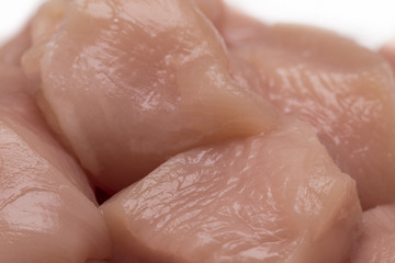 Top view of raw chicken fillet chunks isolated on white