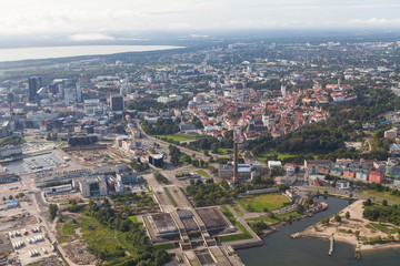 Scenic summer aerial shot of the very Old Town with old Olympic concert hall in Tallinn, Estonia