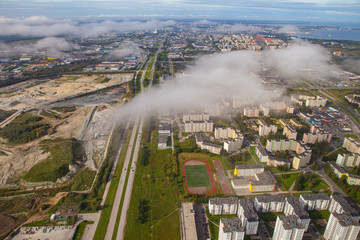 Fototapeta premium Aerial view of an European suburb. Old ore mine and living blocks.