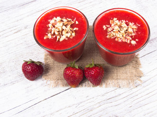 Strawberry smoothie with fresh fruit .