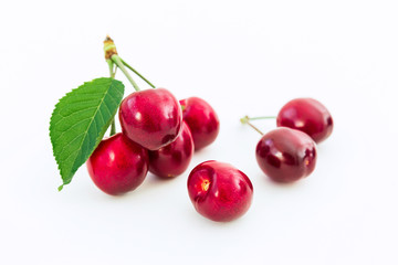 Cherry and leaf on white background. Summer tasty berries