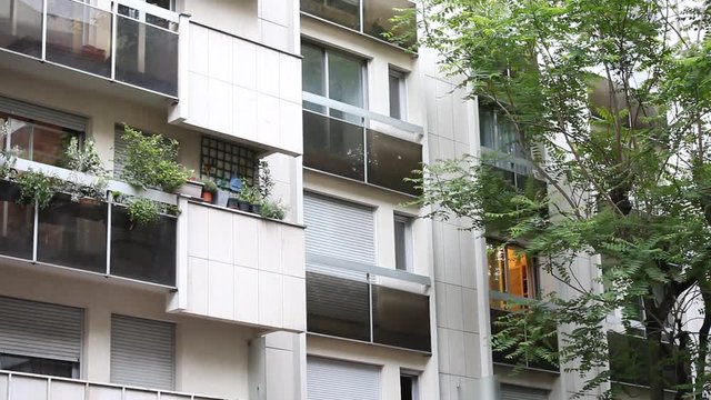 establishing shot of modern residential apartment building in Paris