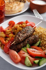 Kebabs with bulgur and vegetables