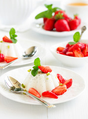 Creamy panna cotta with strawberries.