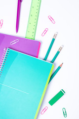 School stationery on white background with copyspace