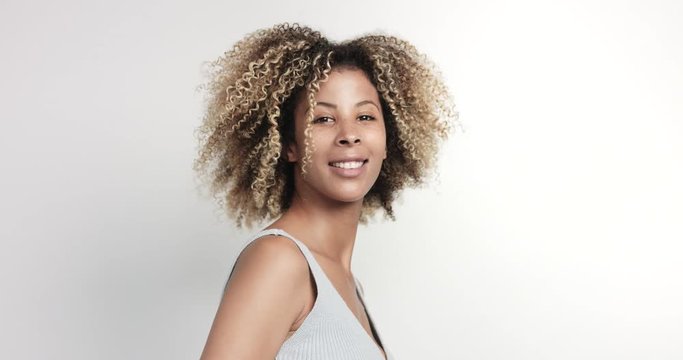 black woman with curly afro hiar portrait