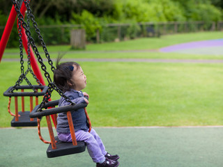 baby girl playing in the playground