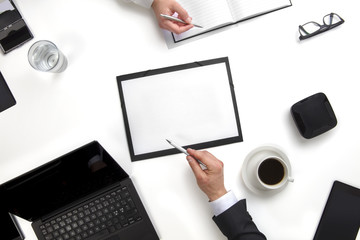 Business Colleagues Discussing Working On Documents At Desk