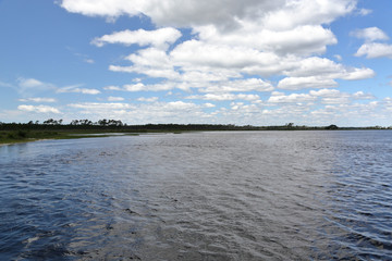 Rippled water surface and cloudy blue sky