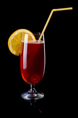 Red long cocktail on black background