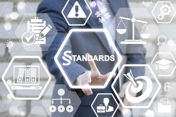 STANDARDS LAW COMPLIANCE REGULATIONS BUSINESS concept. Businessman touched paragraph standard text...