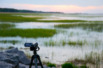 Video nature sea sunset. The camcorder takes a wild landscape. The creativity of the filmmakers...