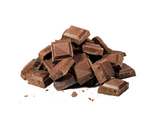 Closed up pile of chocolate chunks isolated on white background  