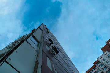 Fototapeta premium A unique angle of view of the old vintage house from the bottom up, along with another house nearby