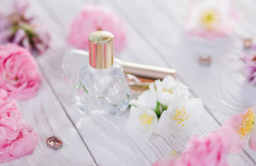 Bottles of perfume with flowers