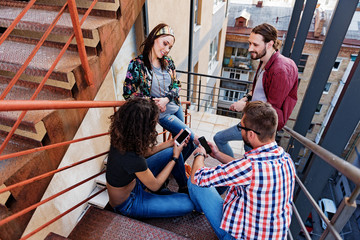Happy young people having fun on stairs