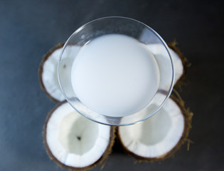 Coconut cocktail on background