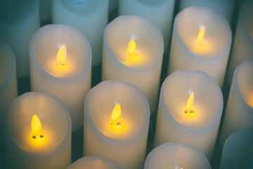 Candles light background of candles group In church