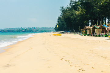 Goa, India, beach Querim Beach. Idyllic tropical sandy beach.