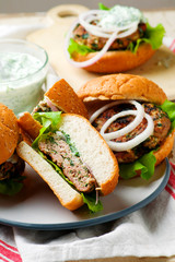 greek turkey burgers tzatziki sauce.selective focus