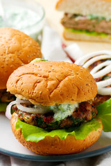 greek turkey burgers tzatziki sauce.selective focus