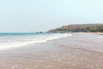 Goa, India, the beach of Arambol. Idyllic tropical beach, coastline of the ocean.