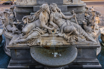 Fragments of the Pallas Athena (goddess of wisdom) fountain, in front of the Austrian Parliament Building. The figures symbolize the rivers Danube, Inn, Elbe and Moldau. Vienna, Austria, Europe.