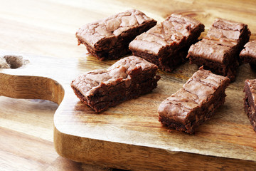 Brownie stack, chocolate cake on rustic wooden board