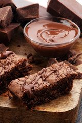Brownie stack, chocolate cake on rustic wooden board