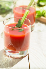 Two glasses of tomato juice.