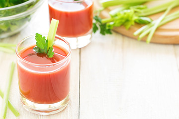 Two glasses of tomato juice.