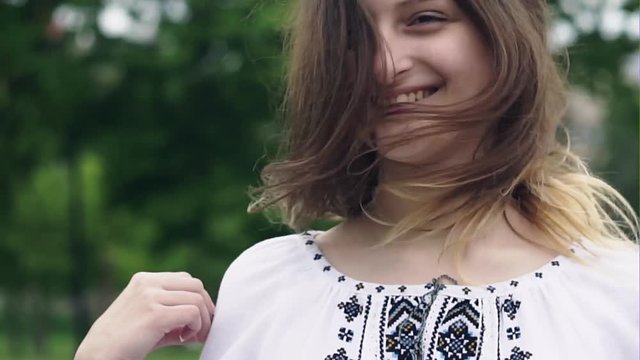Portrait of beauty girl in embroidered shirt
