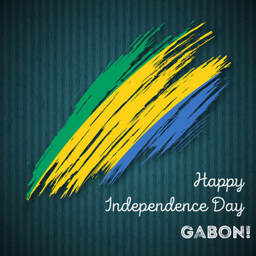 Gabon Independence Day Patriotic Design. Expressive Brush Stroke in National Flag Colors on dark striped background. Happy Independence Day Gabon Vector Greeting Card.