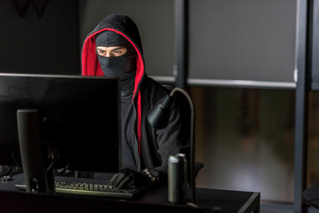 Serious hacker breaking information from digital device