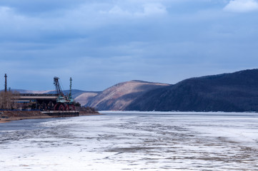 Amur River under the ice, embankment of Komsomolsk-on-Amur