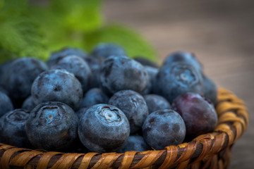 Arrangement ripe blueberries in wicker