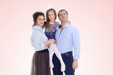 Happy parents with a small daughter.