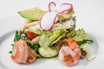 Healthy food. Spring salad from vegetables, herbs and shrimps. Horizontal frame