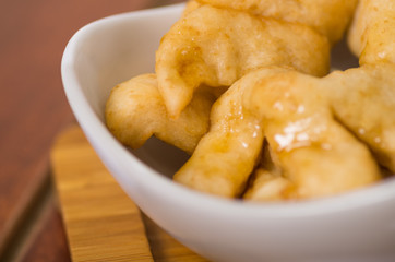 Closeup of delicious ecuadorian pristinos, piled up fresh from the fryer, traditional andean pastry suitable for coffee meetings