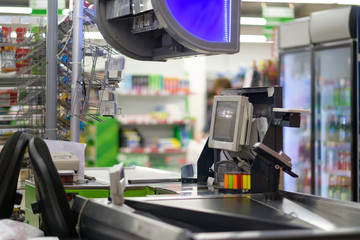 Close up of empty cash desk terminal with computer screen and belt