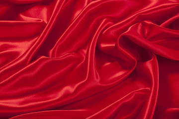 Red satin fabric background.