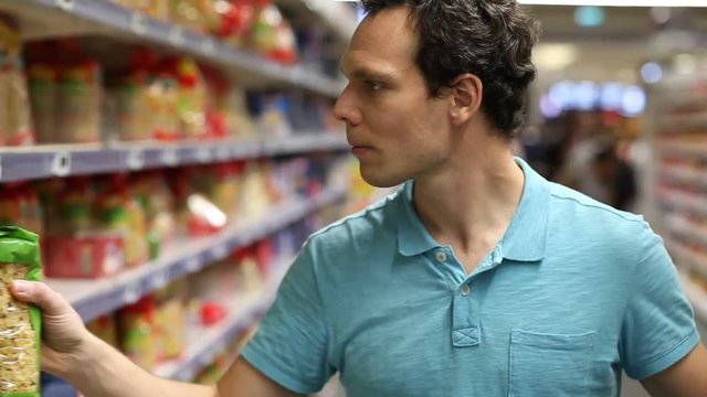 people in grocery store, man choosing food in supermarket, buy food