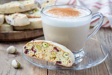 Biscotti with cranberry and pistachio with cup of coffee latte