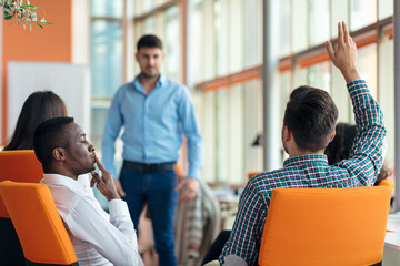 business, startup, presentation, strategy and people concept - man making presentation to creative team at office