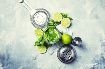 Mojito cocktail ingredients and bar tools, drink background, top view