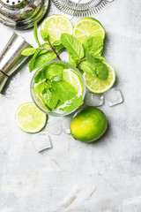 Mojito cocktail ingredients and bar tools, drink background, top view