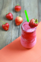 Strawberry Smoothies in Glass on foods table floor.